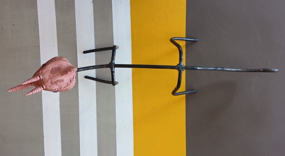 This is how it started. Cast iron frame with the sculpted head of the chameleon.