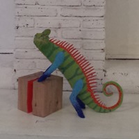 Mimus, an award winning chameleon. Sold (2015). Post-use material, air hardning clay and glass beads.