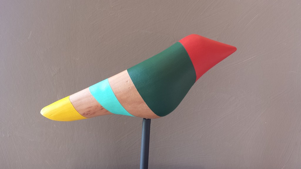 Multicolored, redheaded bird