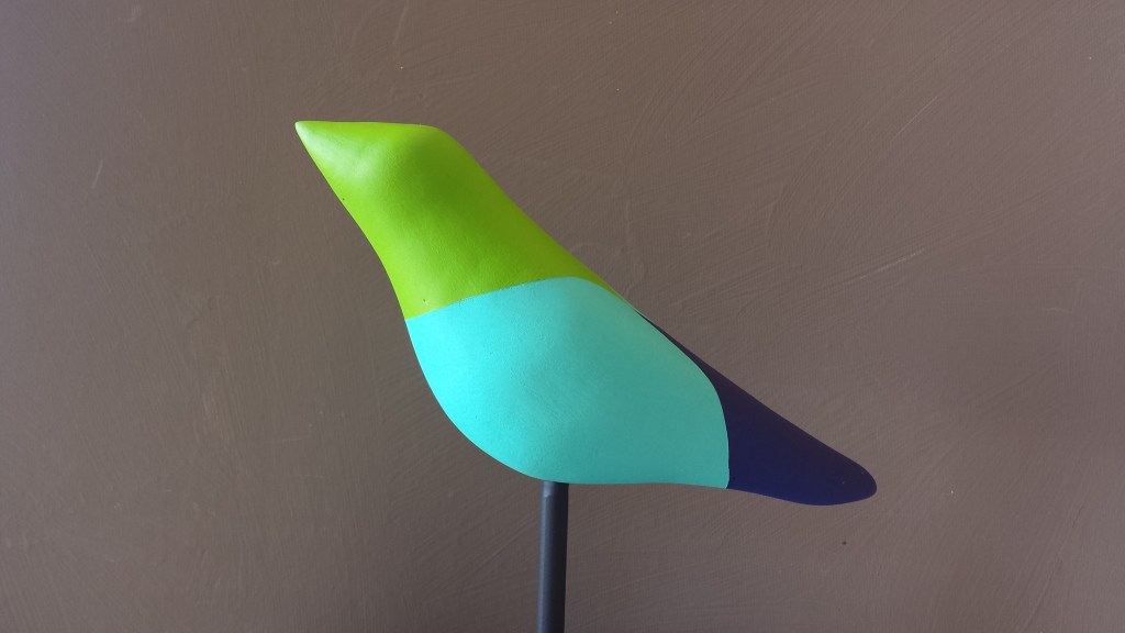 Multicolored, green headed bird