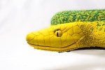 Lola, hybrid python inspired by two species; Morelia viridis y Dendroaspis angusticeps. Post-use material, air hardening clay and glass beads.