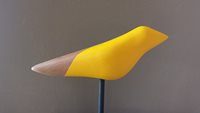 Yellow and natural wood birdie.